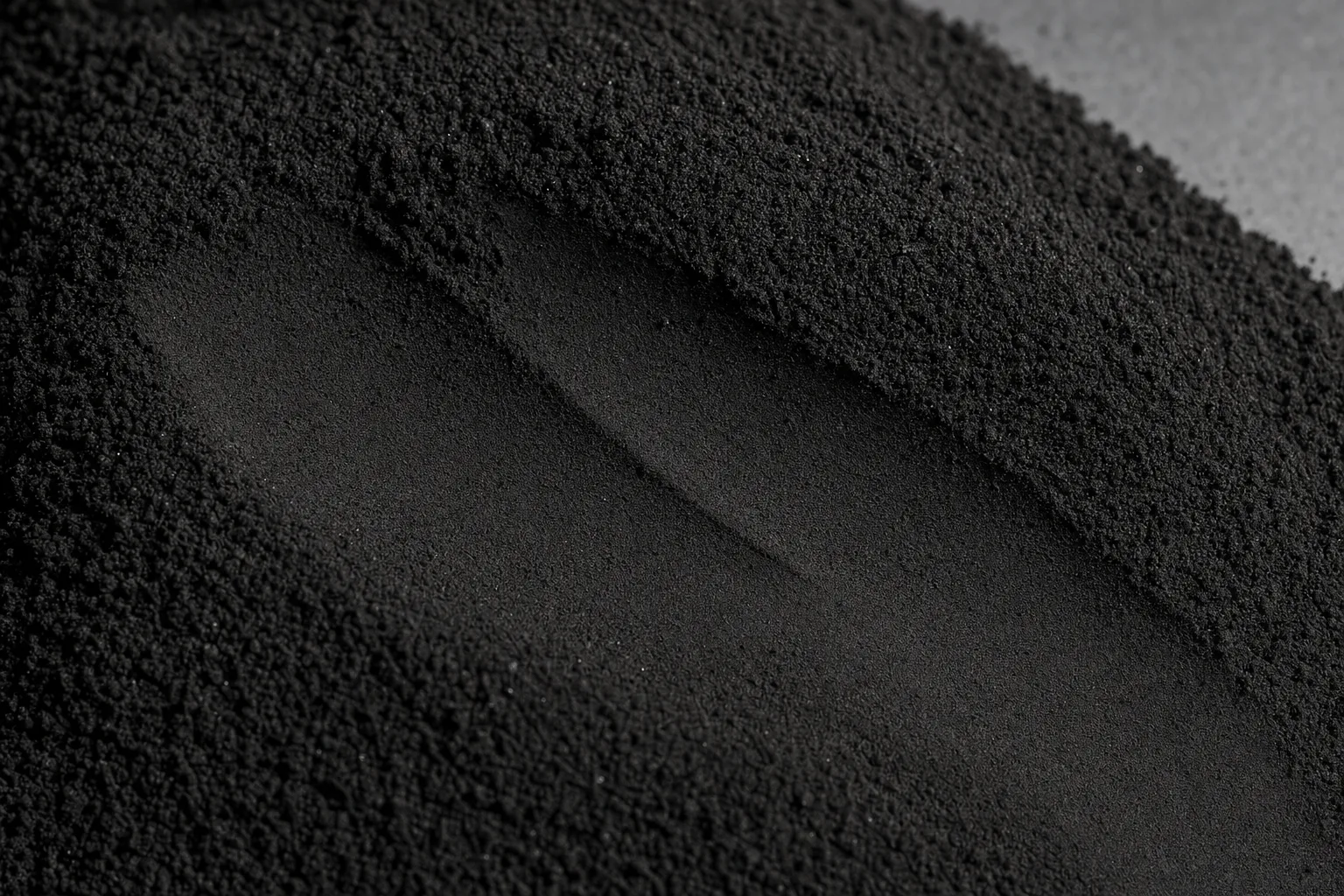 Close-up of carbon black, showing particle size and texture.