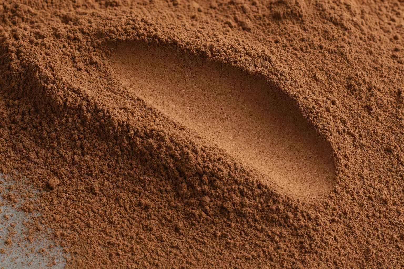 Close-up of cocoa powder, showing particle size and texture.
