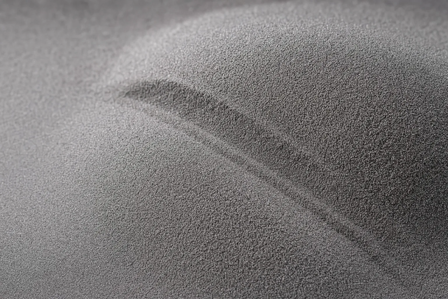 Close-up of metal powders for additive manufacturing, showing particle size and texture.