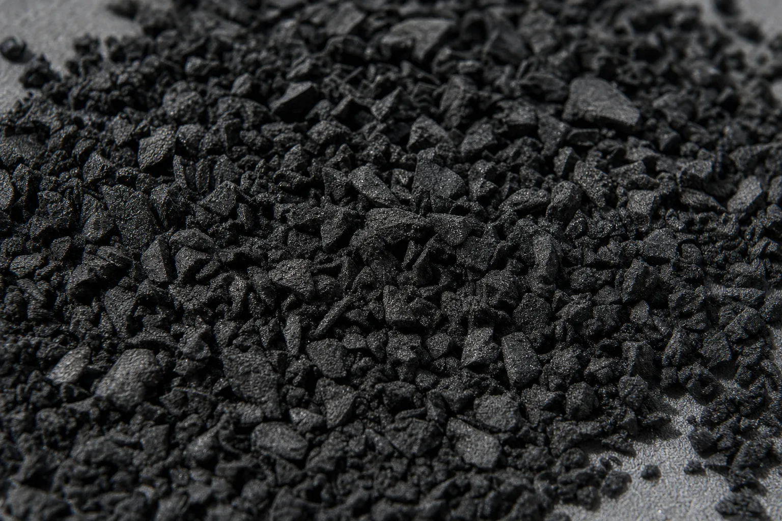 Close-up of rubber crumb, showing particle size and texture.